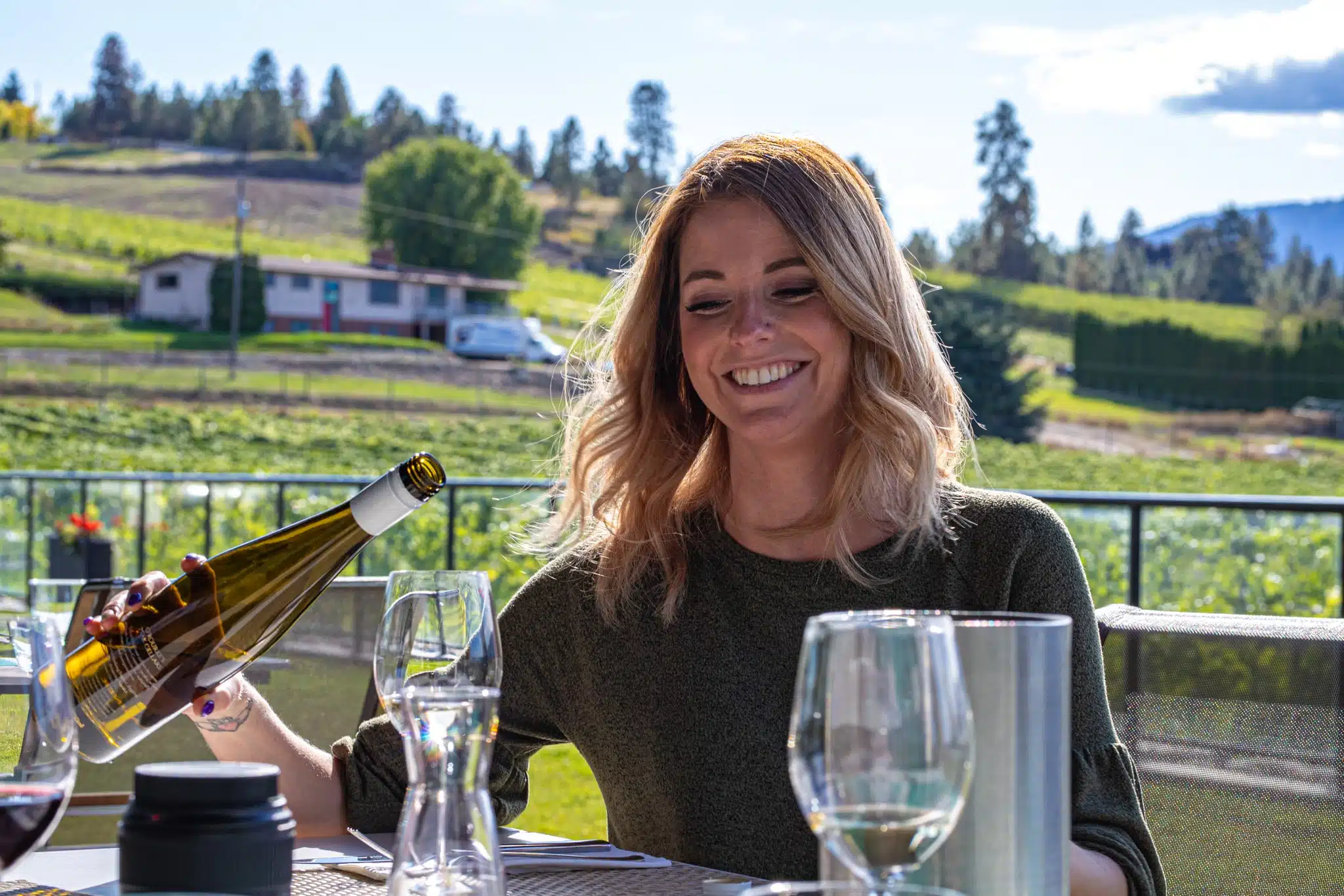 Enjoying wine with dinner in Lake County, British Columbia along a wine tour