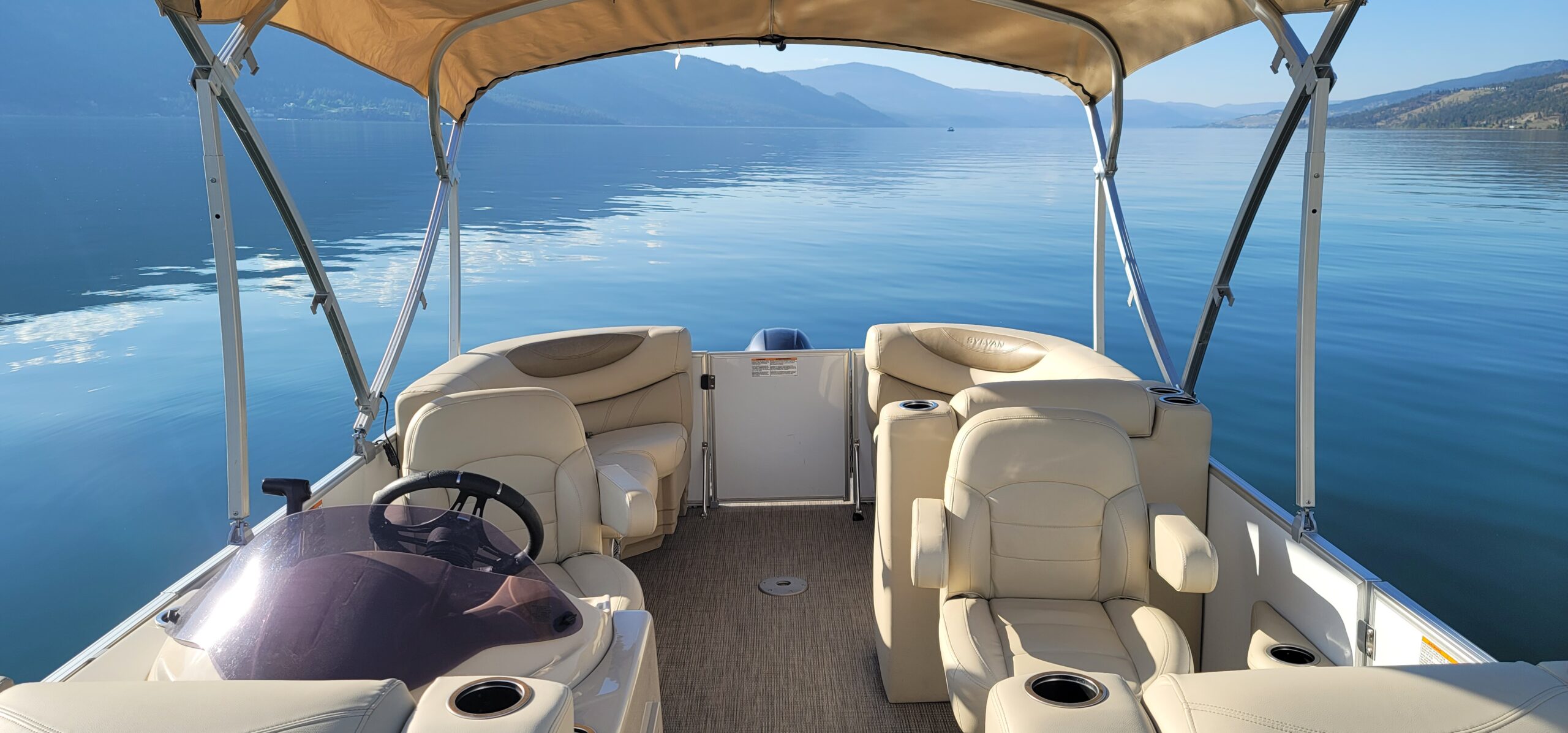 Luxury pontoon boat for tours on Okanagan Lake