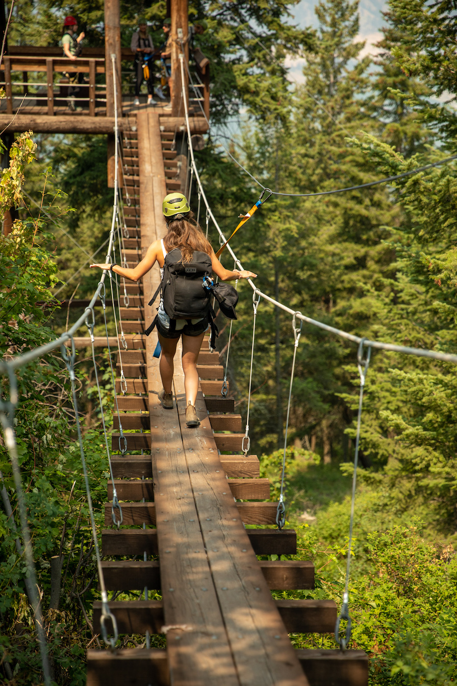 Walking a suspension bridge on a zipline tour in Kelowna, British Columbia
