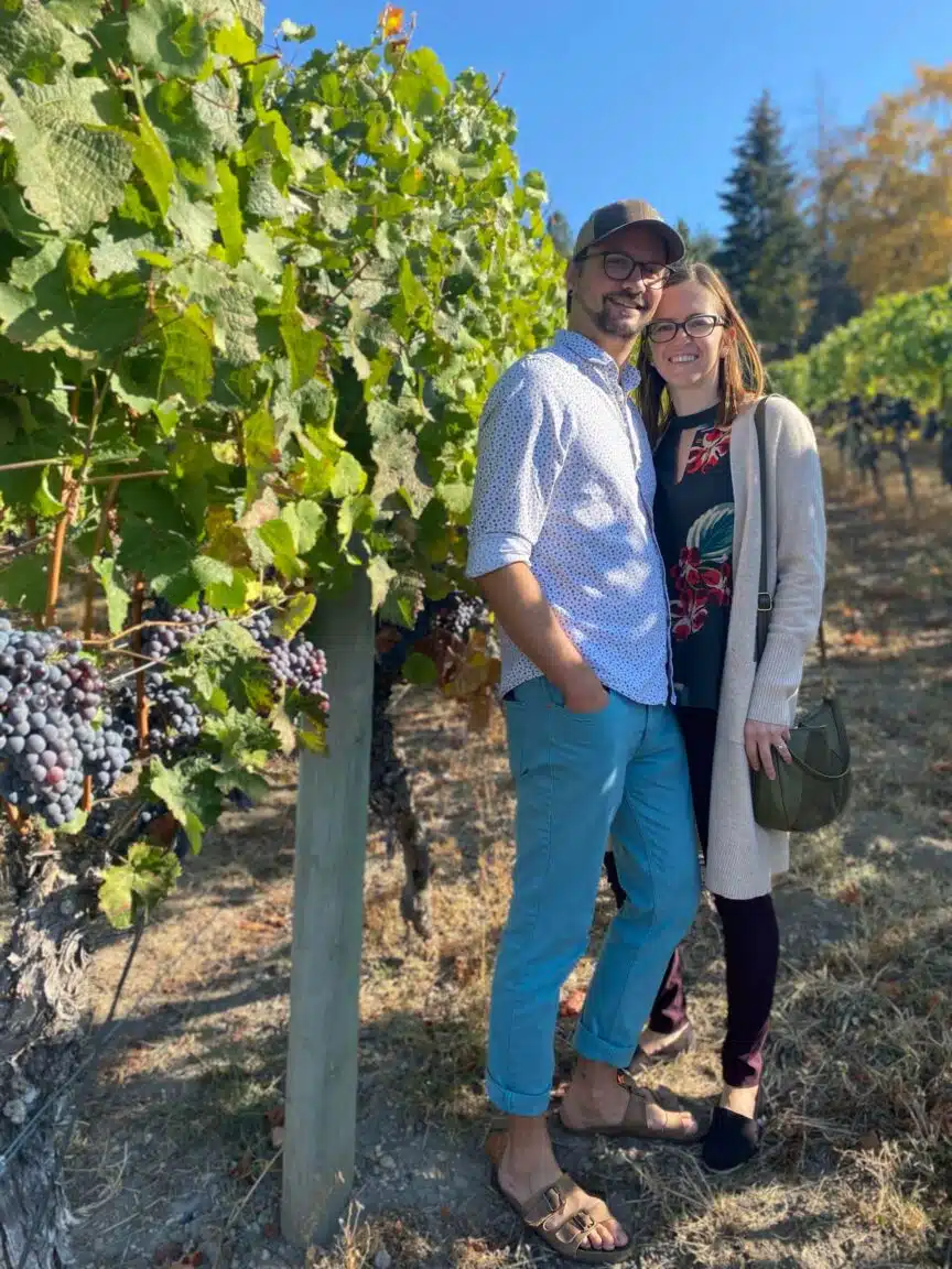 Couple stopping for a photo in the vineyard, Lake Country, B.C.