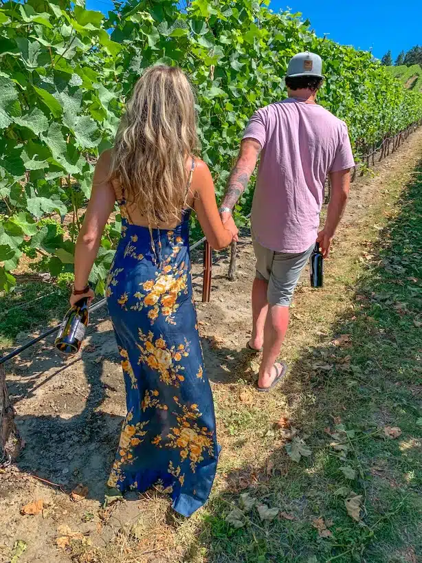 Walking through the vineyard on an Okanagan wine tour